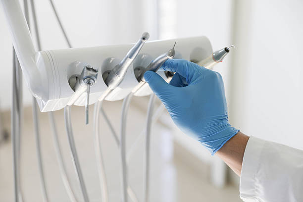 Professional Tooth Extraction technician working in Sullivan, IL